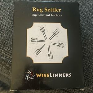 Rug settler - slip resistant anchors